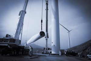 Mobile crane lifting and assembling a wind turbine